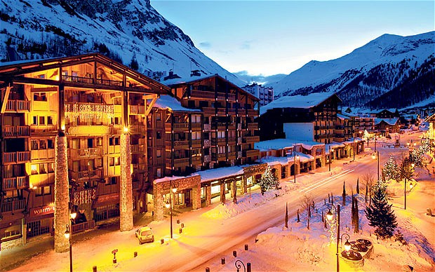 Night time view of Val dIsere ski resort street and buildings