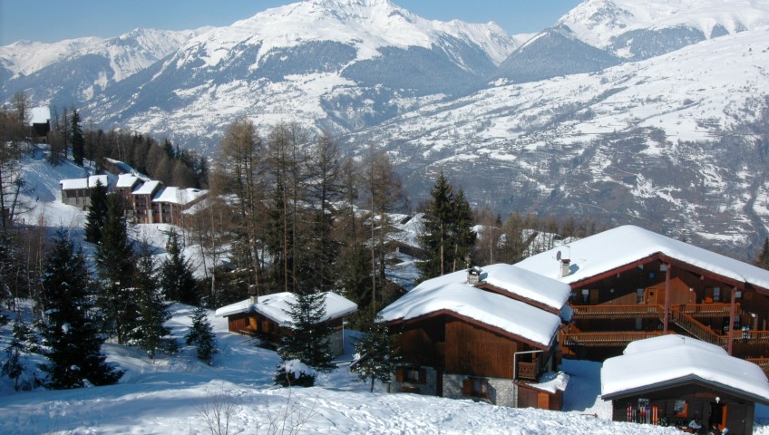 Ski chalets on the mountainside covered in snow