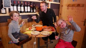 family eating fondu