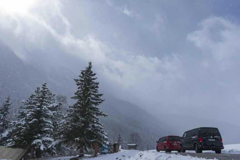 VW vans driving in snow