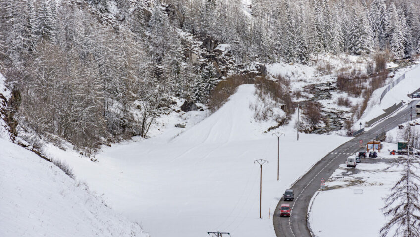 Snowy mountain road from above