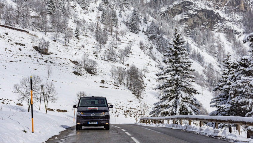 Mountain Rescue Transfers Van driving directly at you on snowy mountain road