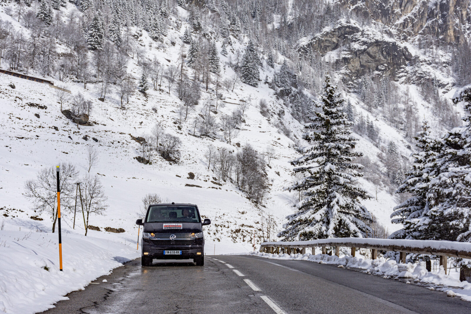 Mountain Rescue Transfers Van driving directly at you on snowy mountain road