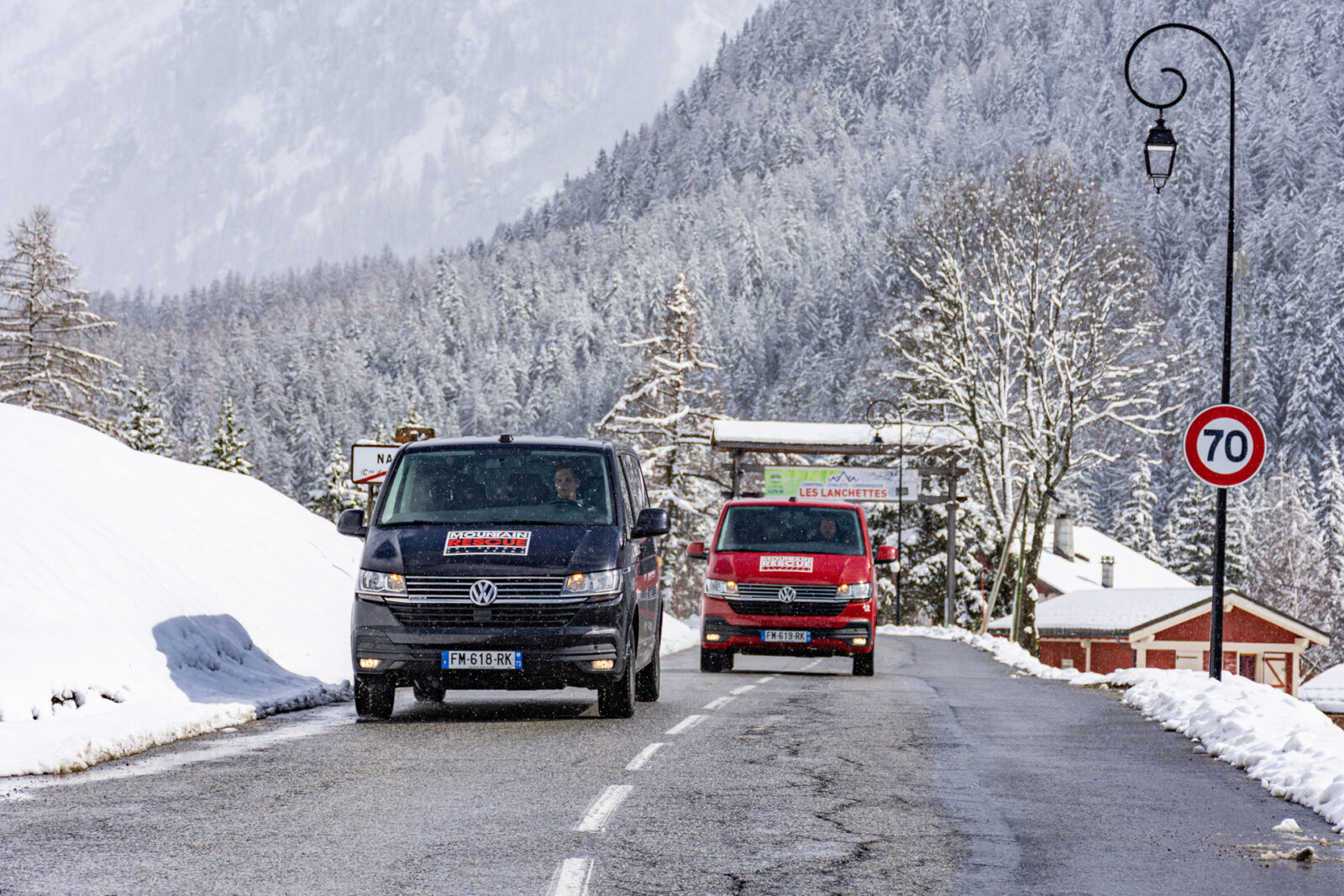2 Mountain Rescue ski transfer vans driving in French Alps