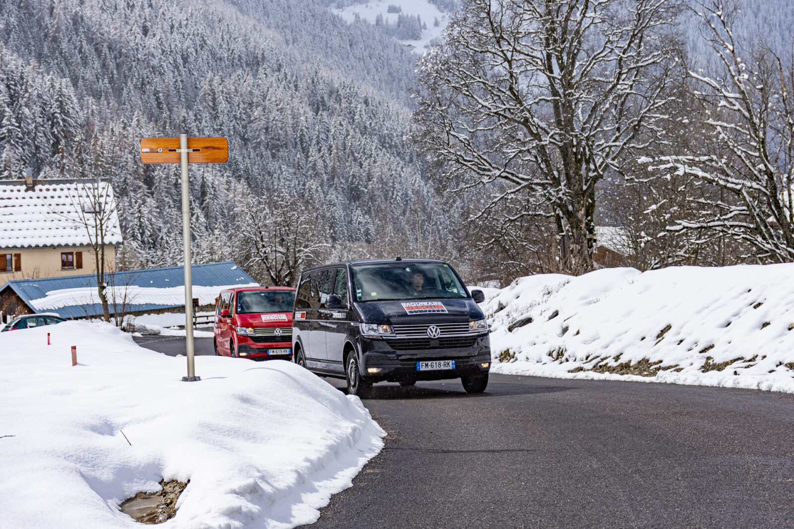 two miniuses driving no road in ski resort