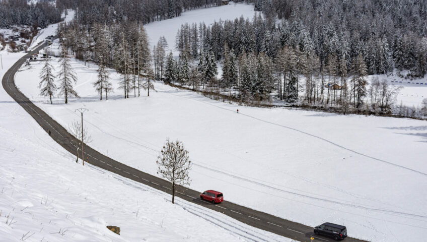 Mountain road through stunning, snow covered valley