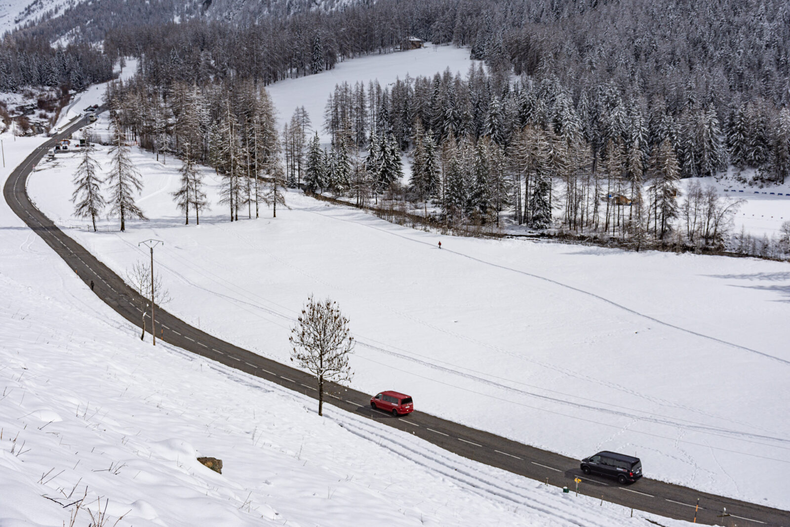 Mountain road through stunning, snow covered valley