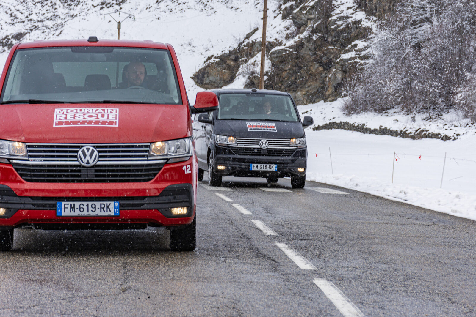 One van overtaking another on mountain road